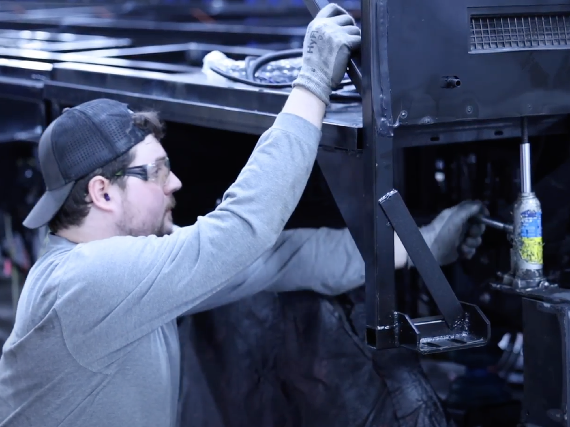 Elias, man with special needs, working at his welding job.