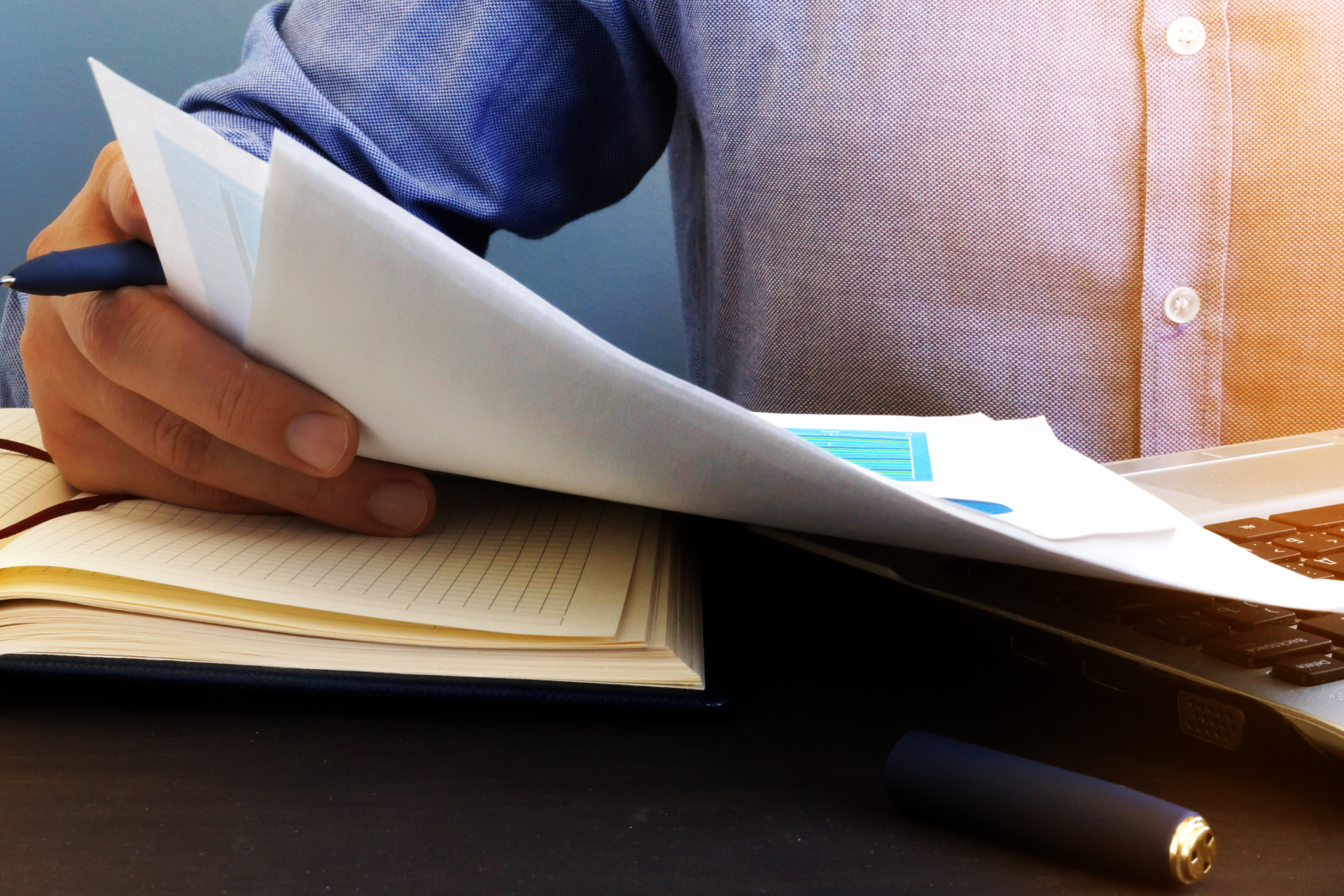 A staff member reading through an online report.