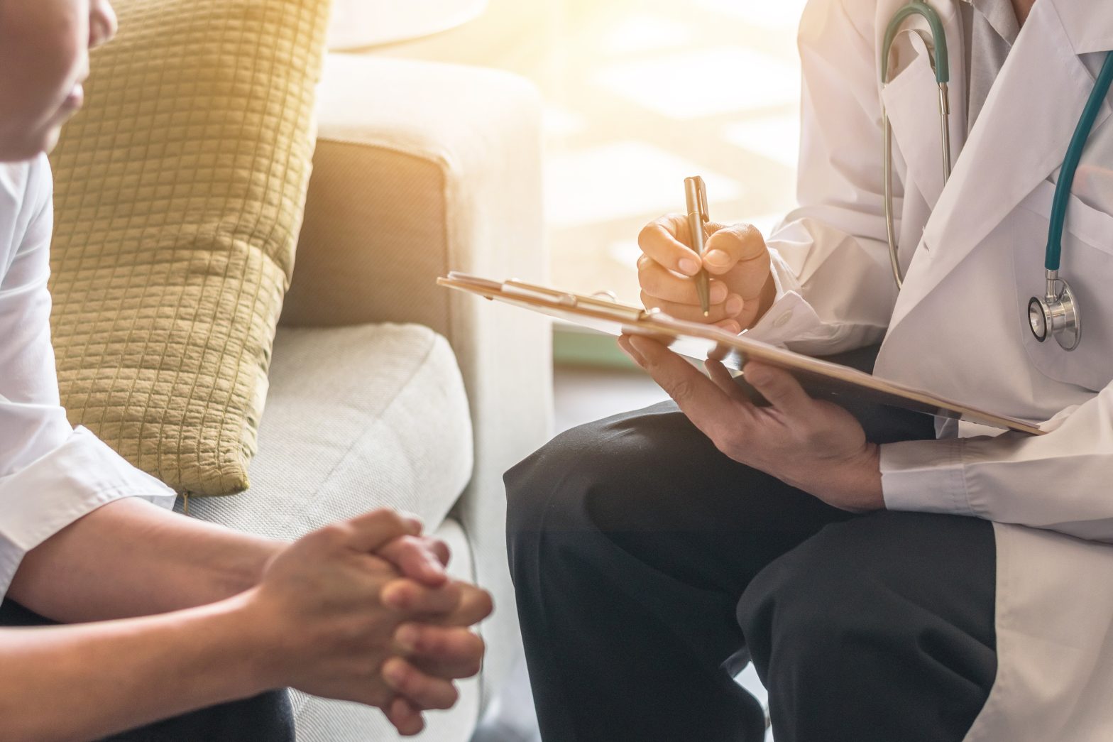 Patient having consultation with doctor (gynecologist or psychiatrist) and examining health in a mental health service center.