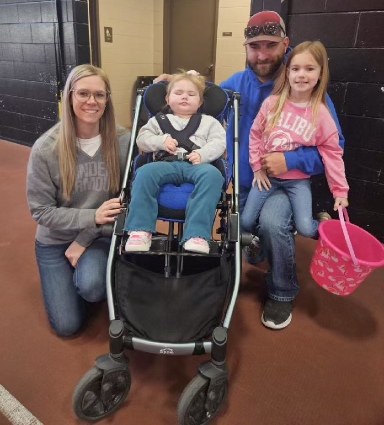 Kori with her parents and sister.