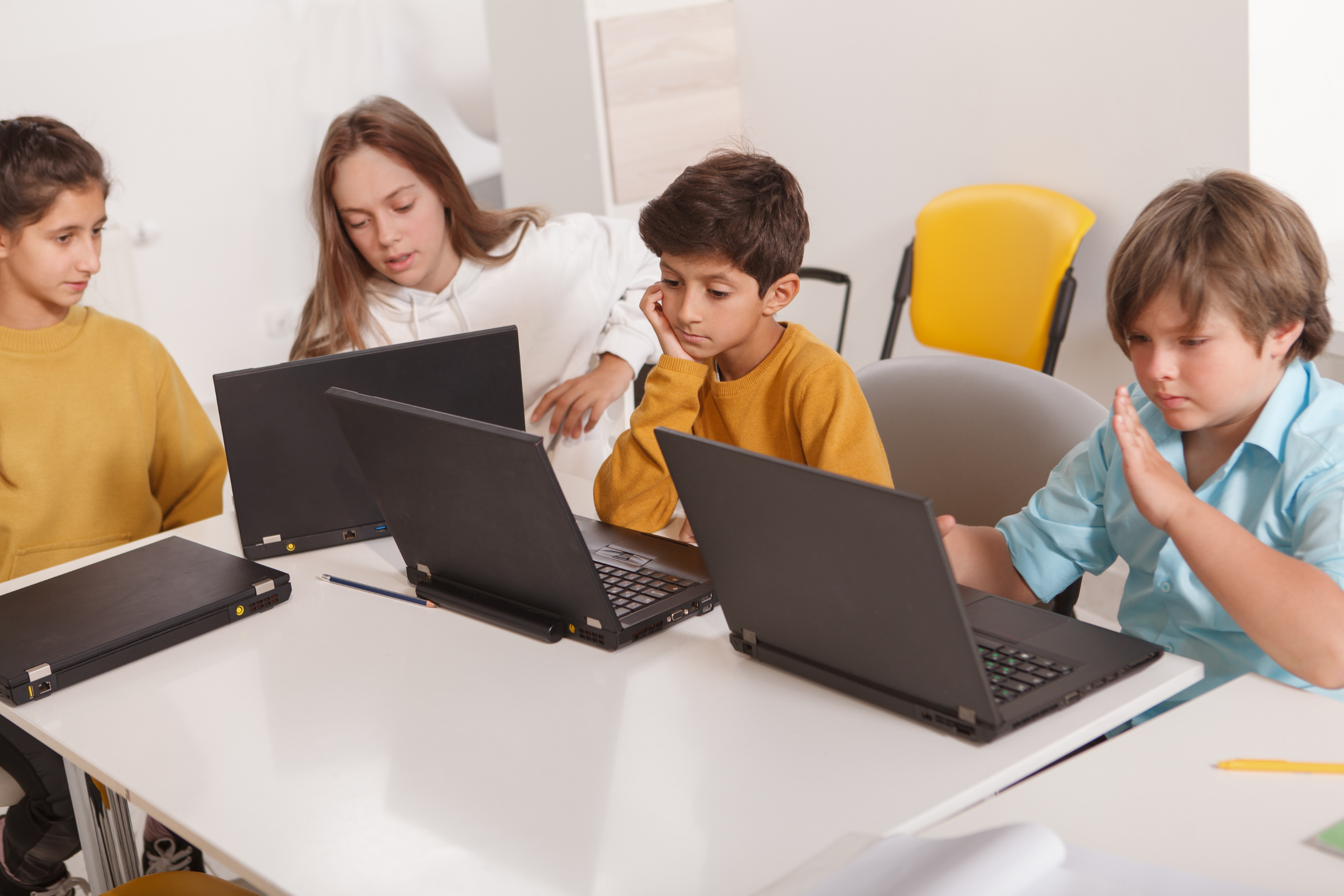 Students working on laptops.